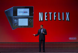 In this photo provided by Nintendo of America, Reggie Fils-Aime, Nintendo of America's president, announces new developments for the Nintendo 3DS portable video game system at the Game Developers Conference in San Francisco on March 2, 2011. Nintendo has partnered with Netflix to enable Nintendo 3DS owners to instantly stream Netflix movies and TV shows directly to their Nintendo 3DS systems, similar to how the service is used on the Wii console. (Kim White for Nintendo of America)
